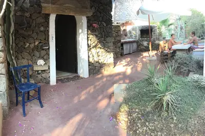 Image de Maison de style Dammuso avec piscine commune à des prix compétitifs