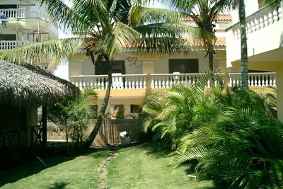 Image de Villa vue mer à Boca Chica dans une urbanisation avec piscines, jardins tropicaux