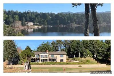 Image de Expansive Lake-Front Home avec quai pour bateau, bain Ă remous, table de billard. . .