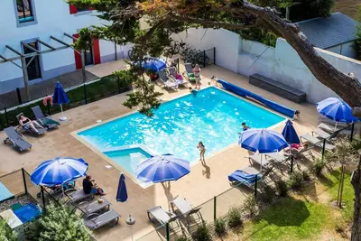 Image de Au pied de la plage! Joli Studio 4p, accès piscine, Wi-Fi Gratuit