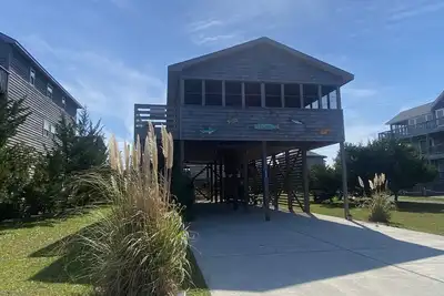 Image de Bientôt votre location de plage préférée, le meilleur porche de tous les temps, et votre chien est le bienvenu