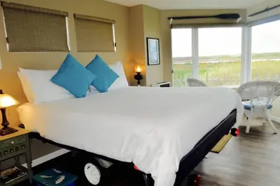 Image de Chambre du capitaine au bord de l'eau Sanctuaire, lit king-size, cheminée, douche pour 2 personnes