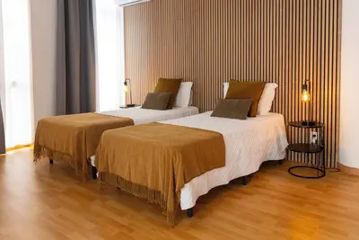 Image de Chambre d'hĂ´tes centrale - Chambre Quadruple avec Salle de Bains Privative