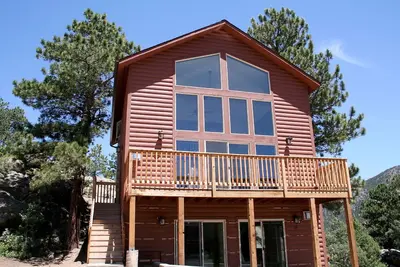 Image de Continental Divide Cabin avec une vue imprenable depuis de grandes baies vitrées