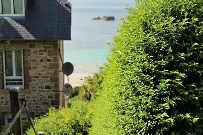 Image de Vue imprenable sur les 7 îles. Accès direct à la plage. Services compris.