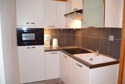Image de 100m des commerces, 1er étage, vue montagne, balcon, télévision, casier à ski, 40m², Les Menuires
