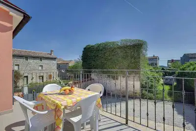 Image de Appartement de vacances avec balcon privé et jardin à usage commun