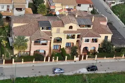 Image de Sardaigne - Villasimius, charmant appartement de trois pièces avec grande véranda couverte.