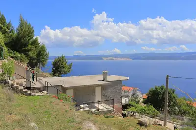 Image de Appartement de deux chambres avec la terrasse et la vue sur le mer Zavode, Omis (A-12075-a)