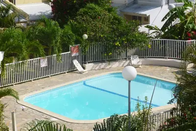 L'Oiseau Des Iles  Agreable Studio en Rdc, wifi chambre climatisée, cuisine