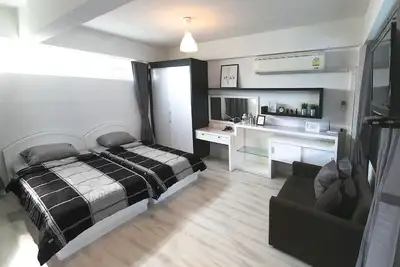 Image de Un studio, 2 lits, Wifi gratuit, à 3 min du Bts Sanampao