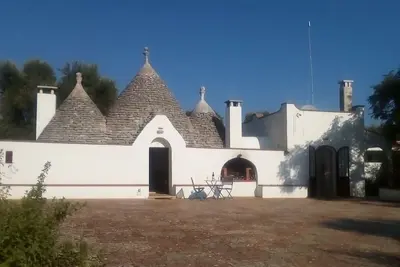 Image de Trullo et Studio avec piscine privée.