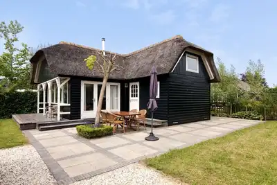 Image de chaumière avec jardin privé près de Gouda