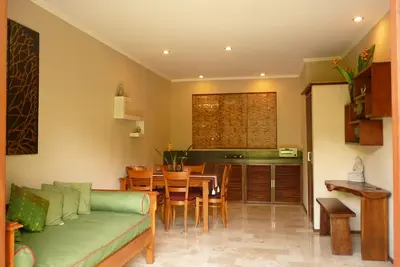 Image de Appartement Jardin avec Piscine Commune