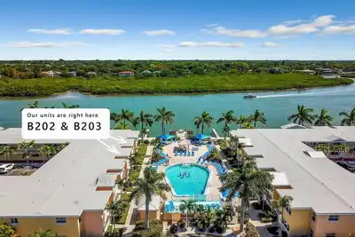 Image de Grande Ouverture! ! ! Superbe condo au bord de la piscine et vue sur l'eau Barefoot Beach - B203
