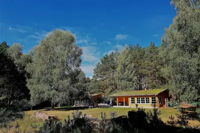 Image de Maisons de vacances sur un terrain naturel avec une plage privée sur le lac Zootzensee