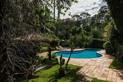 Image de Tranquillité et nature, Wifi, télévision par câble, sauna, piscine, bain et trousseau!