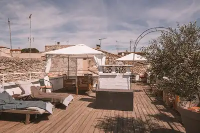Image de Grand appartement de charme au coeur de Nîmes avec Rooftop spectaculaire, garage