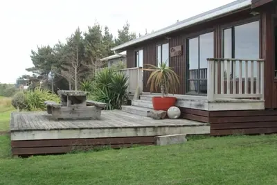 Image de Face à l'océan maison de plage avec douche extérieure chaud.