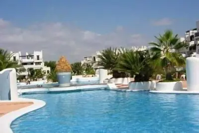 Image de Sunny apartment with private garden overlooking pools near Cala D’or Marina