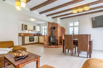 Image de Appartement Confort - Mönchgut - Nouveau: Cottage avec cheminée, 2 salles de bain, 2 chambres à coucher - au bord de l'eau