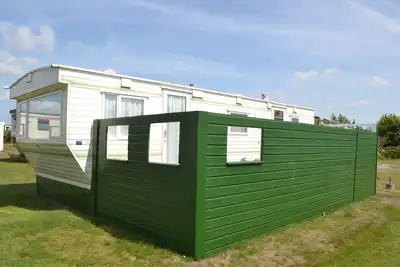 Image de Chalet Ameland Loisirs avec le soleil toute la journée sur la terrasse