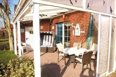Image de Maison de vacances Neßmersiel pour 1 - 6 personnes avec 3 chambres à coucher - Maison de vacances