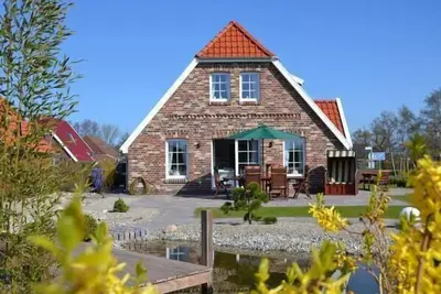 Image de Maison de vacances Neßmersiel pour 1 - 6 personnes avec 3 chambres à coucher - Maison de vacances