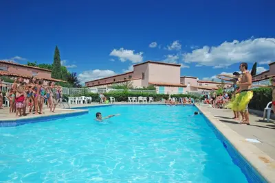 Image de Maison de Vacances avec Climatisation | A 250m de la Plage, Accès Piscine!