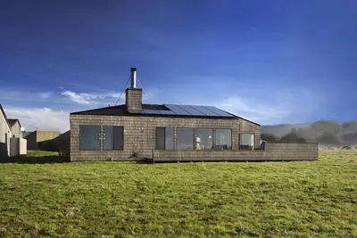 Image de Accueil confortable face à l'océan tamponné par une prairie de 30 acres