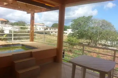 Image de Condo convivial avec vue sur la mer et jacuzzi extérieur privé à Sosua