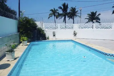 Image de Maison Beira Mar avec piscine et cascade à Mongaguá avec 06 suites