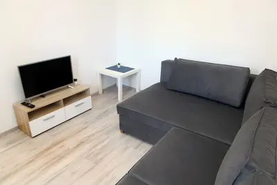 App avec balcon et vue sur le jardin