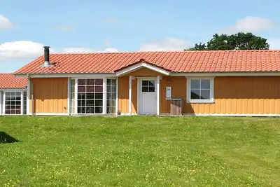 Image de Maison de vacances pour 8 dans un parc de vacances a GrĂĄsten