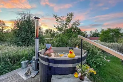 Image de traumHaff Pilote romantique avec cheminée, sauna et bateau à Rieth am See