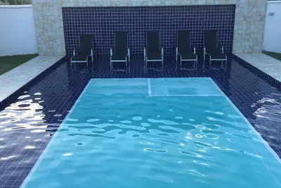Image de Beach House avec piscine chauffée, bain à remous et espace gastronomique
