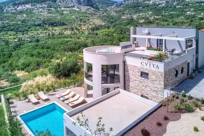 Image de Villa Cvita is a modern 5-bedroom villa with a Jacuzzi, a Gym and Finnish Sauna, a heated pool, and amazing views