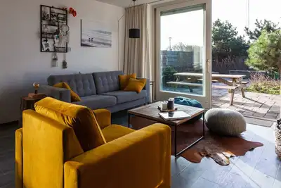 Image de Cozy spacious apartment with its own garden at the foot of the dunes.