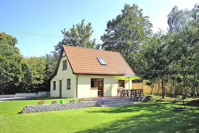 Image de Maison au bord du lac Wilkasy avec barque
