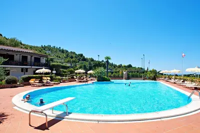 Image de Confortable appartement avec climatisation, Wifi, piscine, Tv, animaux admis et parking