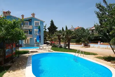 Image de Joli appartement pour 4 personnes avec piscine, climatisation, Tv, terrasse et parking