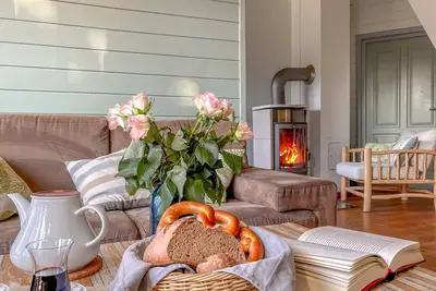 Image de Vacances TraumHaff comme au temps des bateliers avec chaloupe, sauna et cheminée