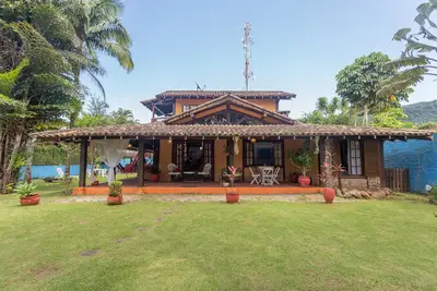 Image de Maison heureuse et confortable Ă Barra do Sahy