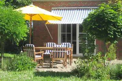 Image de Campen Cottage - chalet rustique de style shabby chic près de la côte de la mer du Nord