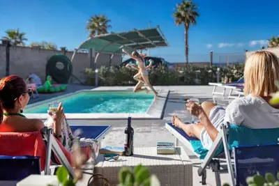 Image de Pistacchio - 2-bedroom apartment with large lateral sea view terrace and pool in the garden