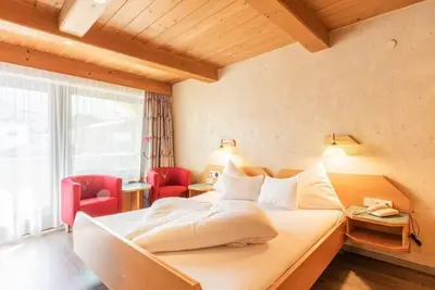 Image de Chambre double Haus Hohe Munde - The Kaltschmid Familotel Tirol