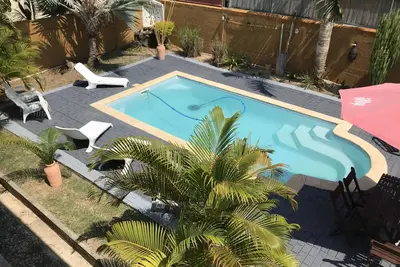 Image de Grande Villa avec piscine  dans un quartier résidentiel à 5 minutes de la plage