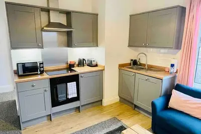 Image de Confortable appartement situé au centre d'une chambre