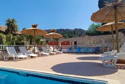 Image de Gitelacapelle avec 2 chambres piscine, à 10mm plages sauvages, cadre tropic. . . .