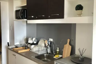 Image de 1 Br Condo near Airport, Bgc with Netflix, Fiber Wifi in Grace Residences